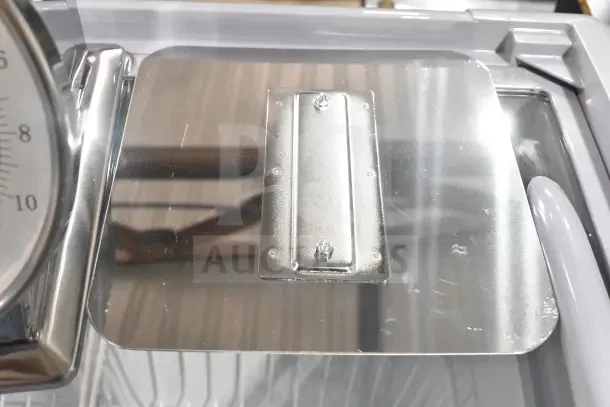 BRAND NEW Galaxy 177GPCM2 2 lb. Mechanical Portion Control Scale showing a stainless steel platform, minor scratches.