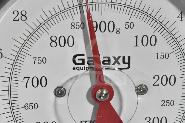 Galaxy 177GPCM2 2 lb. Mechanical Portion Control Scale, brand new with scratches and dents, shows weight in grams and ounces.
