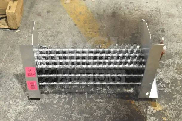 Brand new Avantco 17818766 evaporator coil for UDD and UBB series, with visible scratch and dent markings and a pink label.