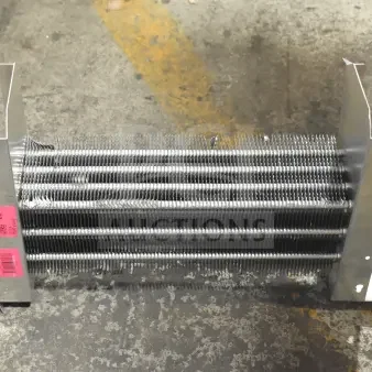 Brand new Avantco 17818766 evaporator coil for UDD and UBB series, with visible scratch and dent markings and a pink label.