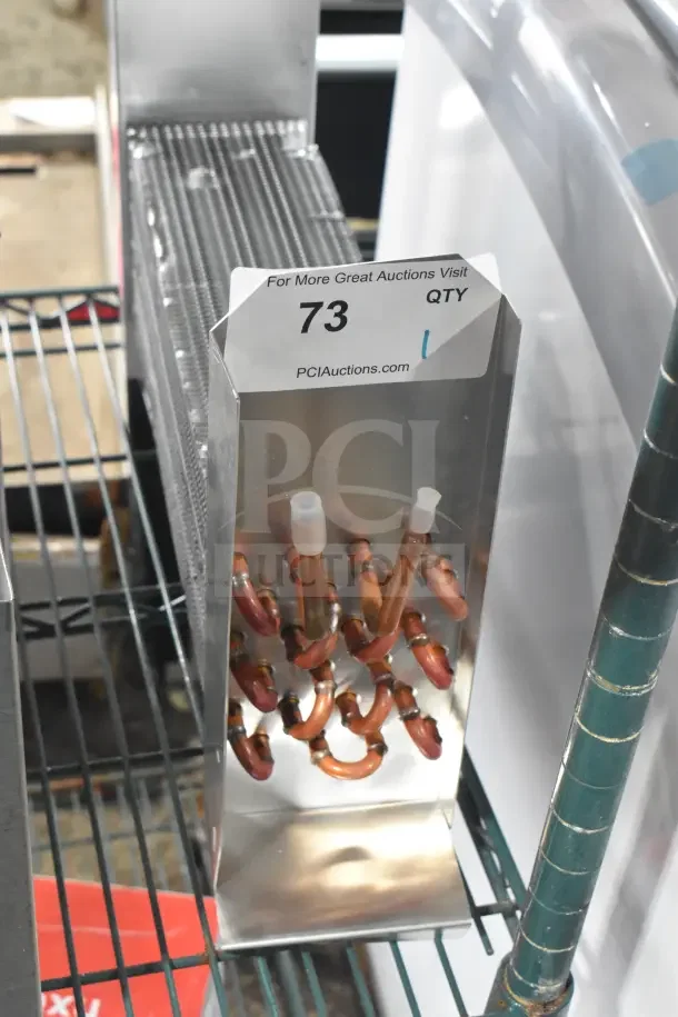 Brand new Avantco 17818766 evaporator coil for UDD and UBB Series, showing copper tubes and metal fins, with auction tag.