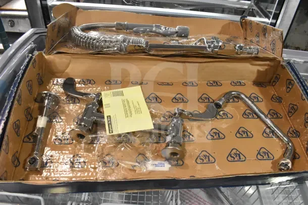 Brand new T&S MPY-8DLN-08 pre-rinse faucet, 24.5" high, with adjustable 8" centers, low flow spray valve, 24" hose, 8" add-on faucet, and 6" wall bracket. Box shows scratch and dent condition.