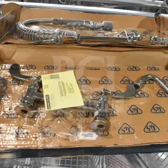 Brand new T&S MPY-8DLN-08 pre-rinse faucet, 24.5" high, with adjustable 8" centers, low flow spray valve, 24" hose, 8" add-on faucet, and 6" wall bracket. Box shows scratch and dent condition.