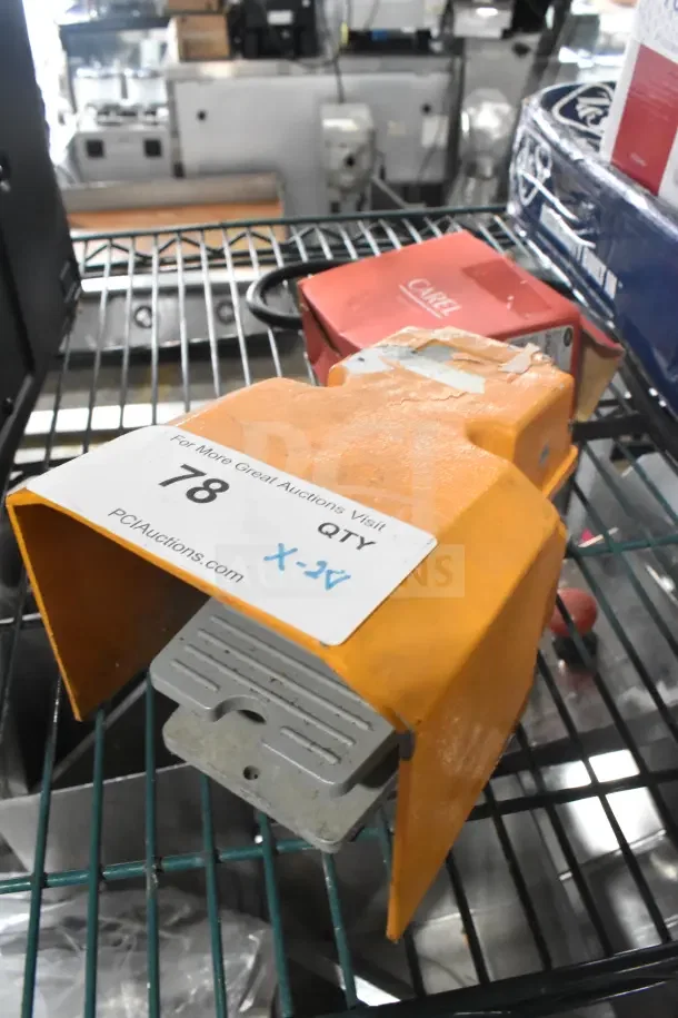 Two items including foot pedal and Carel IJFPSA4B01S1054 food panel with auction tag "78," on a metal shelf.