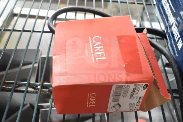 Red Carel IJFPSA4B01S1054 food panel box with visible label on a metal shelf alongside a foot pedal unit.