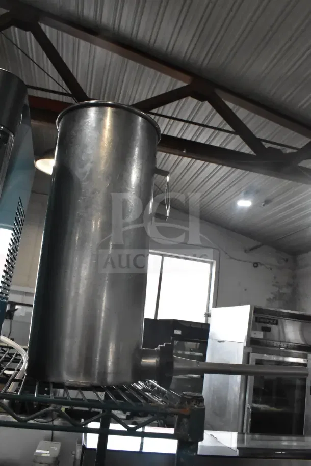 Stainless steel vegetable chute with pusher for meat slicer, featuring robust construction and a polished finish.