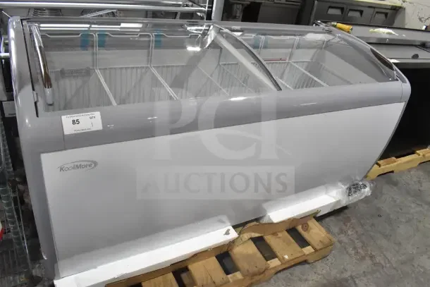 Brand new KoolMore MCF-20C ice cream display freezer, 20 cu. ft., scratch and dent, 115V, 1 Phase. Visible model label.