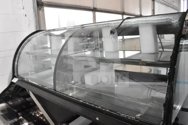Avantco 193CAC60B Black Curved Dual Service Air Curtain Merchandiser, 59 1/8", glass damage shown, 115V, 1 Phase.