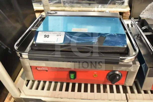 Brand new Avantco 177PG200S Panini Grill, smooth plates, 13 3/8" x 8 3/4" surface, 120V, with minor scratches.
