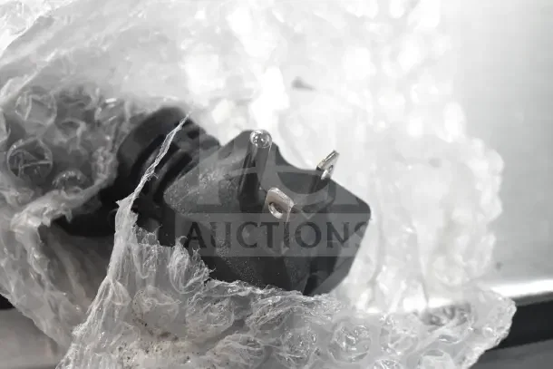 Close-up of the plug for Avantco 184T3300B conveyor toaster, wrapped in bubble wrap, indicating new condition.
