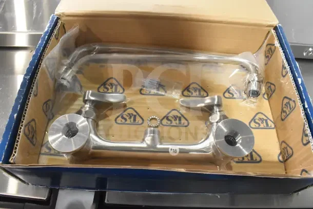 Brand new Eversteel by T&S S-0231 stainless steel wall mount double pantry faucet with 12" swing nozzle in box.