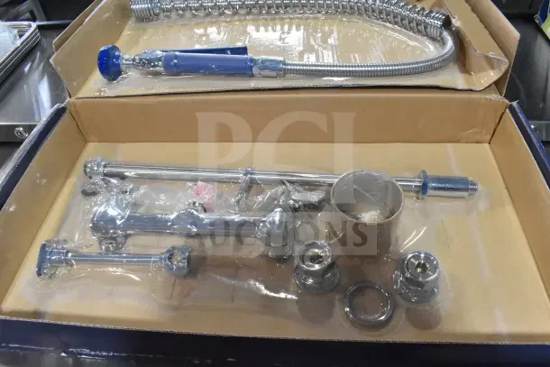 Brand new Fetco Waterloo 750PRW8X wall-mounted pre-rinse faucet, 1.15 GPM, with 8" centers, some minor scratches.