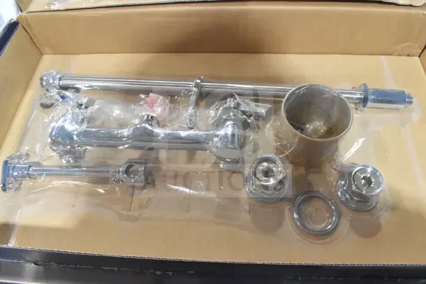 Brand new Waterloo 750PRW8X pre-rinse faucet, 1.15 GPM, wall-mounted with 8" centers, scratch and dent condition.