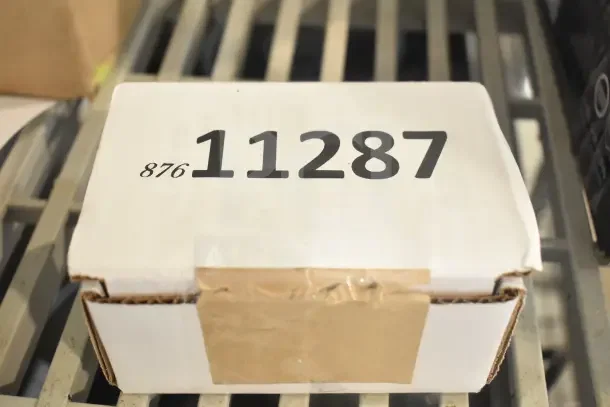 Cardboard box with label "11287" and number "876" visible. Contains three brand new Vulcan parts, sealed.
