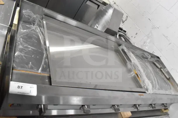 Brand new Cooking Performance Group GM-CPG-72-NL 72" gas countertop griddle, manual controls, 180,000 BTU, minor scratches.