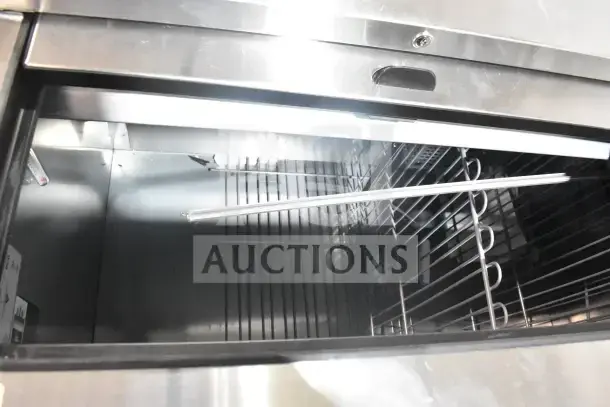 True TD-65-24-HC commercial back bar bottle cooler, brand new, with 2 sliding lids. Scratch and dent condition. 115 volts, 1 phase.
