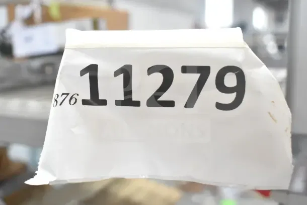 Auction item tag showing number 11279, indicating listing for Cal-Mil C971-5INF Infusion Chamber and Vulcan Grease Can.