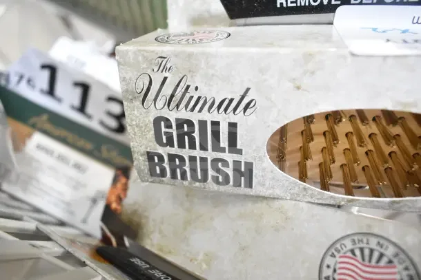 Malish UGB Ultimate Grill Brush box displaying fine bristles through a window. Brand new, scratch and dent condition.
