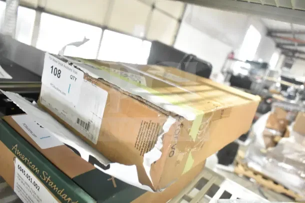 BRAND NEW SCRATCH AND DENT 5105F2SLX08 Equip by T&S faucet boxed with visible dents on the packaging.