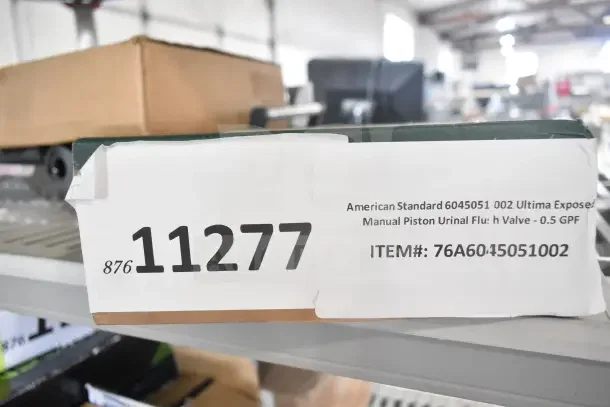 Brand new American Standard 6045051.002 Ultima Urinal Flush Valve, 0.5 GPF, labeled item #76A6045051002, scratch and dent.