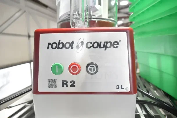 Brand new Robot Coupe R2BCLR food processor, 3 Qt. clear bowl, 120V, scratch and dent, visible control buttons.