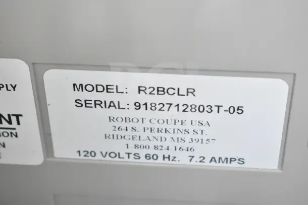 Robot Coupe R2BCLR food processor label showing model, serial number, and electrical specifications. Brand new, scratch and dent.