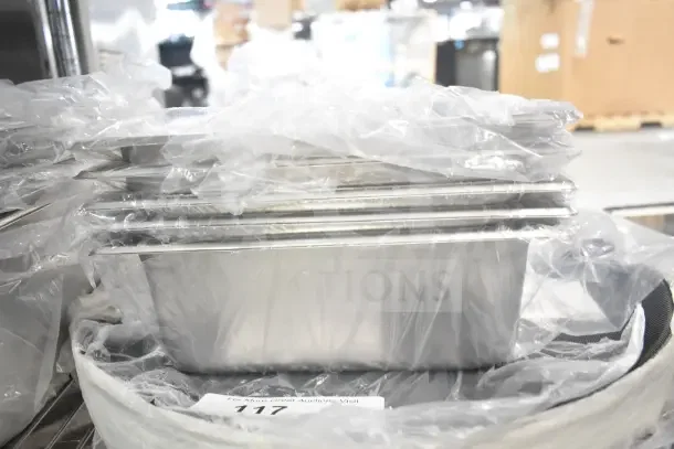 Sealed stainless steel drop-in bins and a non-skid serving tray, brand new scratch and dent items, lot of 17.