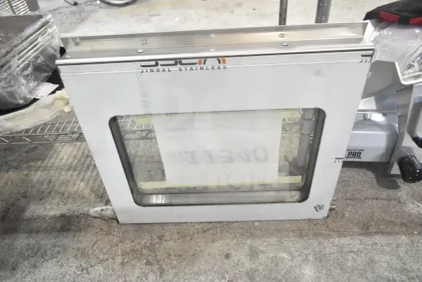 BRAND NEW Southbend 1198056 LH Compartment Door Assembly with protective film, minor dents, stainless steel, Jindal branding.