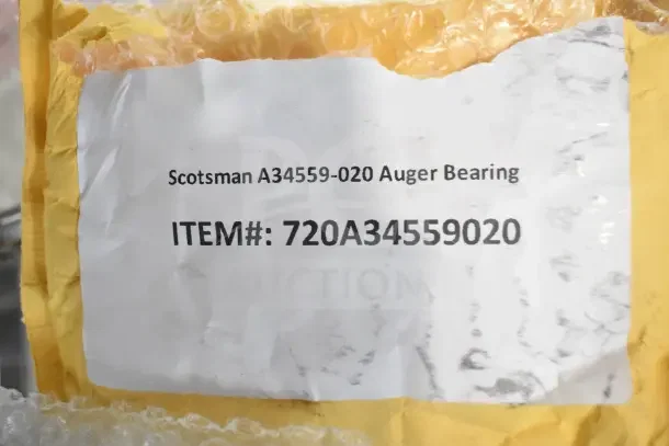 Scotsman A34559-020 Auger Bearing in packaging with label showing item number 720A34559020. Brand new condition.