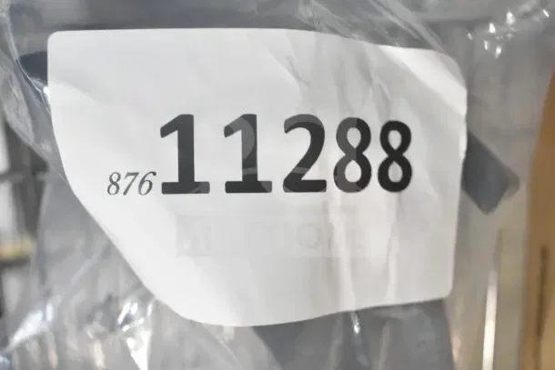Auction lot tag showing number 11288 on a plastic-wrapped package, containing scratch and dent items including Lavex and Hobart products.