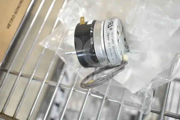 Scratch and dent Southbend 4-T209-1 Timer, 240V, in original packaging, shown on metal rack.