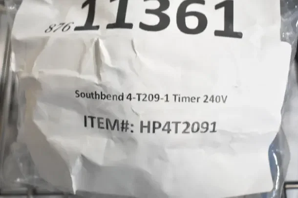 Crumpled packaging showing Southbend 4-T209-1 Timer 240V, item number HP4T2091, part of scratch and dent auction set.