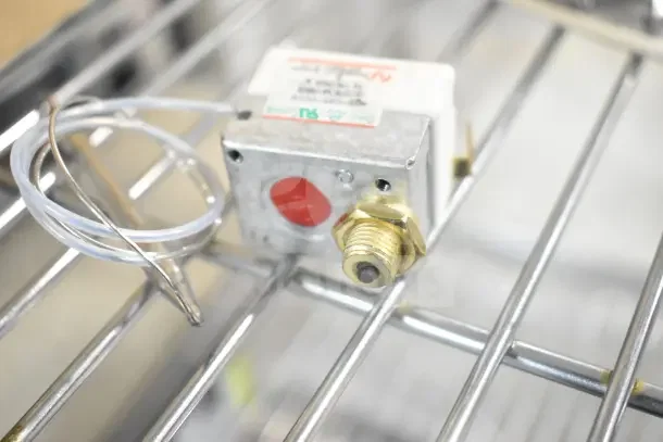 Electrical component with wiring, labeled "00-479348," on a metal rack. New condition, part of a 10-item auction lot.