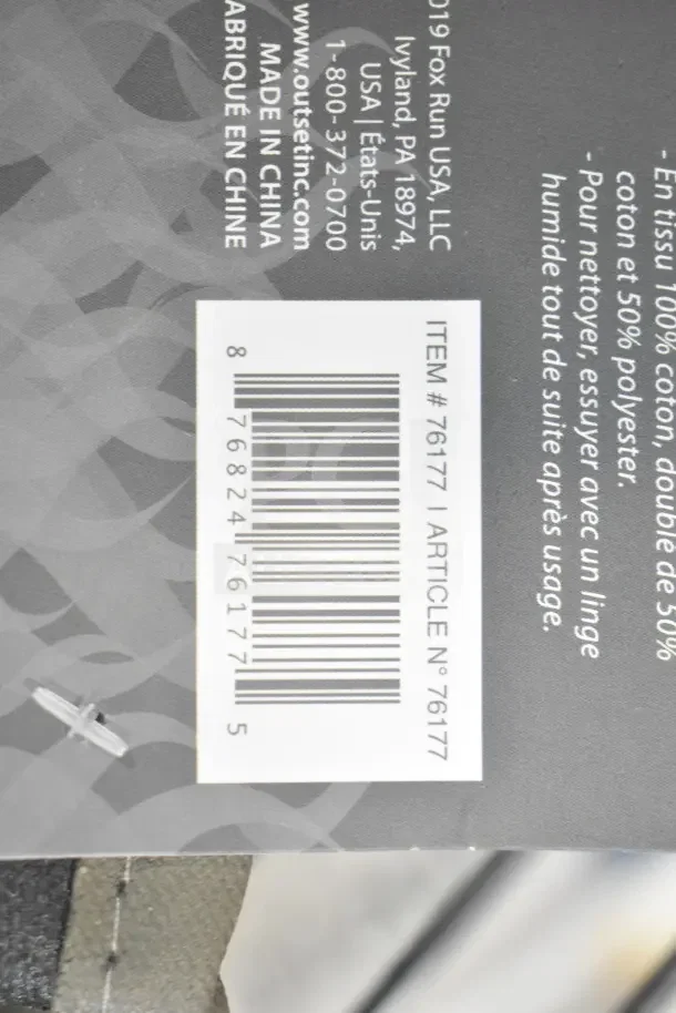 Barcode and label showing item number 76177 of an Outset® black flame retardant oven mitt. Made in China.