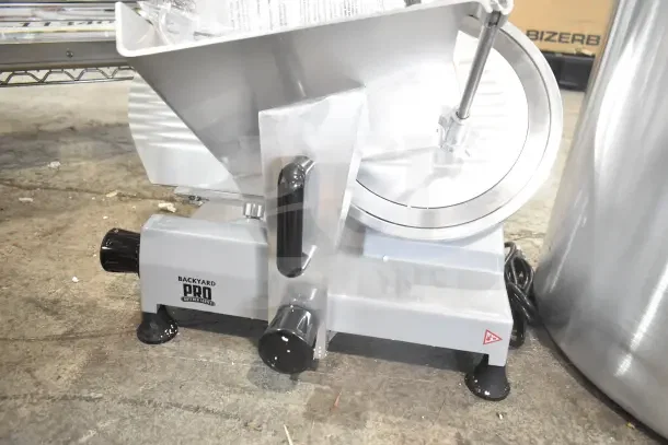 BRAND NEW Backyard Pro 554SL112E 12" meat slicer, gravity feed, built-in blade sharpener, 120V, excellent condition.