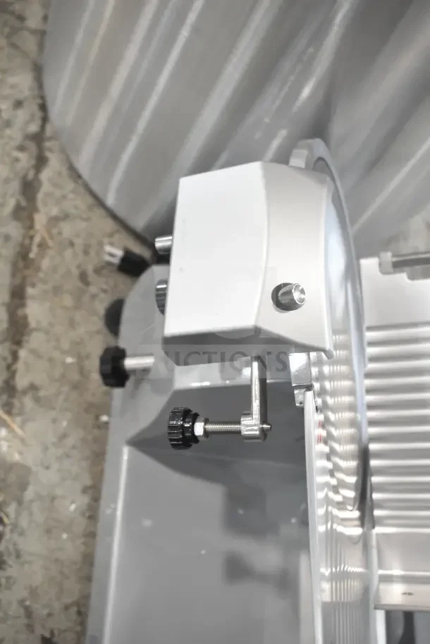 Brand new Backyard Pro 554SL112E butcher series 12" meat slicer. Features a manual gravity feed, blade sharpener.