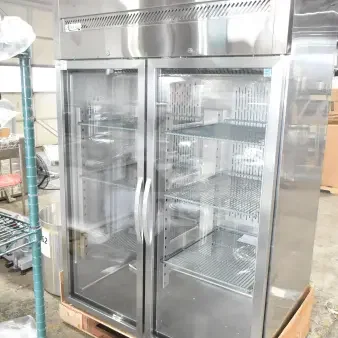 Brand new Avantco 178Z2RGHC commercial 2 door cooler merchandiser, 115V, 1 phase, visible shelves, scratch and dent condition.