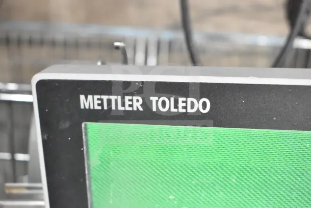 Mettler Toledo AM-5545 commercial countertop scale, tested and working, close-up of display showing brand logo.