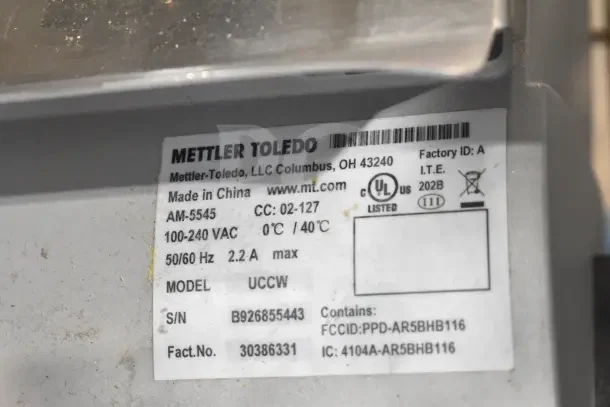 Mettler Toledo AM-5545 commercial countertop scale label, showing specifications and model details, tested and working.