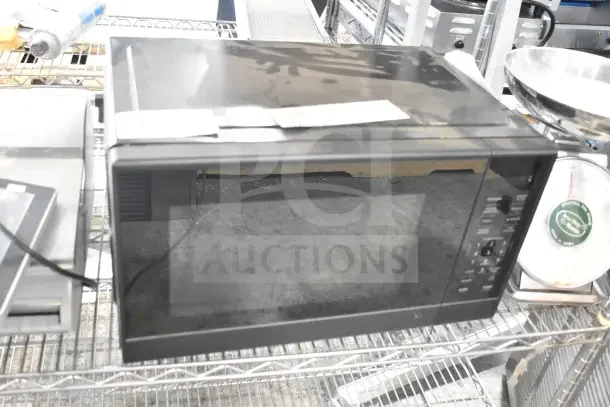 Hamilton Beach MS8436193153-03 countertop microwave oven, black, 120 volts, 1 phase, visible control panel, used condition.