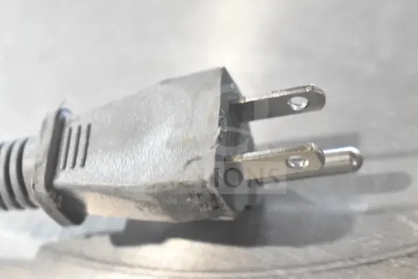 Close-up of a power cord plug for Hamilton Beach MS8436193153-03 Countertop Microwave Oven, 120 Volts, 1 Phase.