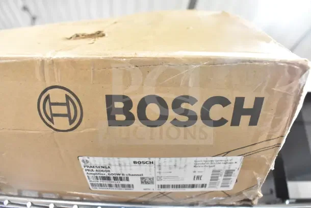 Box of Bosch PRA-AD608, 8 Channel Amplifier, 600W, shown with Bosch logo and shipping label details visible. Box appears slightly worn.
