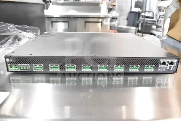 Bosch PRA-AD608 8 Channel Amplifier, excellent condition, features multiple input connections and Ethernet ports.