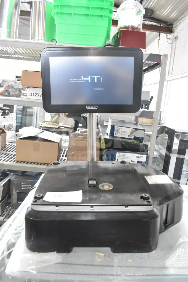 2023 Hobart HTi-SSLSC commercial scale, countertop food portioning model, tested and working, displayed on a shelf.
