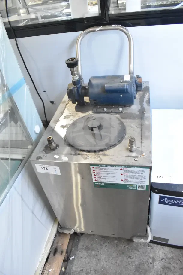 Frontline commercial oil filtration system on casters, stainless steel, with motor and safety labels. Used condition.