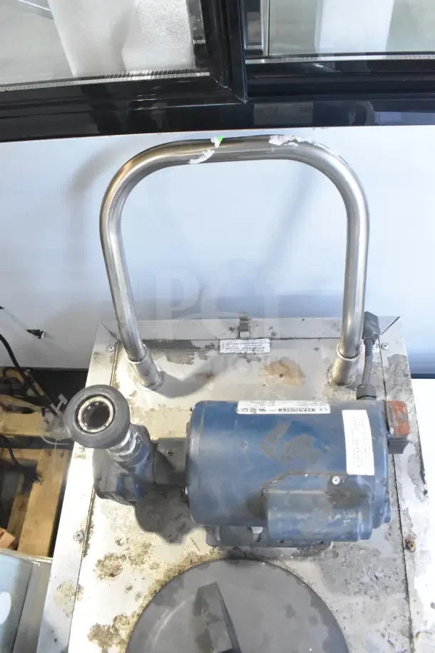 Frontline Commercial Oil Filtration System with casters, visible wear, and labels. Stainless steel handle, blue motor.