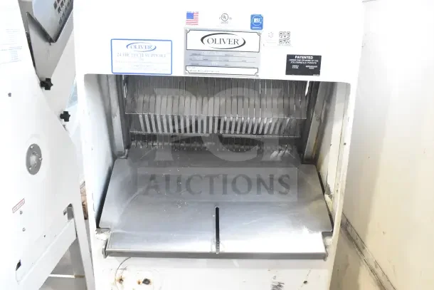 Oliver 797-32NC commercial bread slicer with Pro Guard safety chute, showing blades and stainless surface. 115V, 1 Phase.