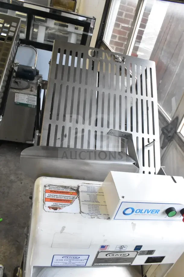 Oliver 797-32NC commercial bread slicer with Pro Guard safety chute, 115 volts, 1 phase. Features sturdy metal construction.