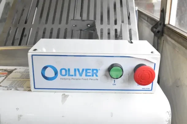 Oliver 797-32NC Bread Slicer with Pro Guard Chute, 115V, visible brand logo and control buttons, excellent condition.