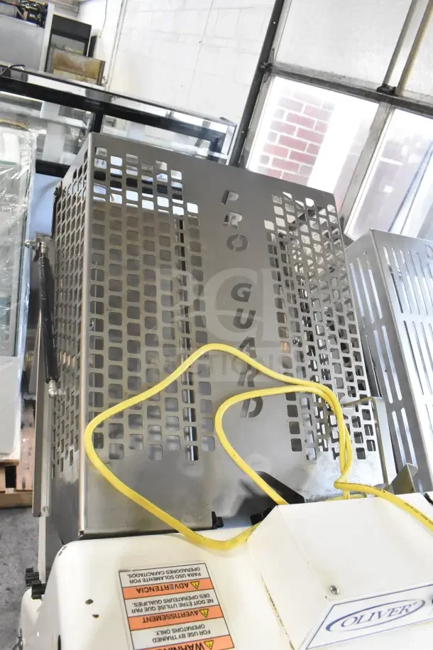 Oliver 797-32NC bread slicer, Pro Guard safety chute, commercial, floor style, 115V, 1 Phase, good condition.